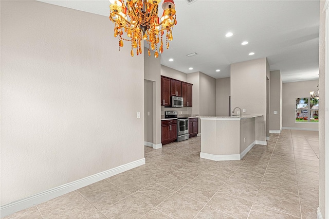 10460 Silver Maple Ave, Oxford, FL 34484 - kitchen with stainless steel appliances, a chandelier, light countertops, baseboards, and a sink