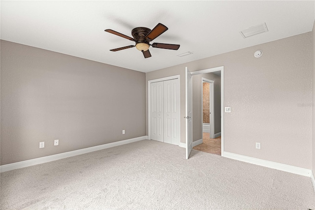 10460 Silver Maple Ave, Oxford, FL 34484 - unfurnished bedroom with light carpet, baseboards, a closet, and ceiling fan