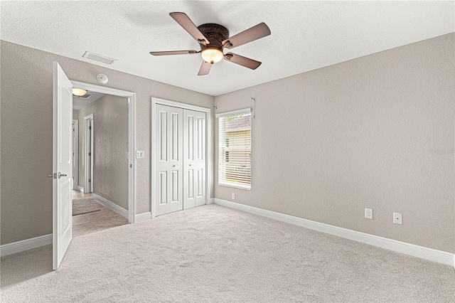 10460 Silver Maple Ave, Oxford, FL 34484 - unfurnished bedroom featuring carpet, ceiling fan, a closet, and baseboards