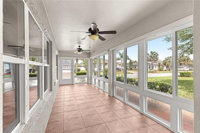 10460 Silver Maple Ave, Oxford, FL 34484 - unfurnished sunroom featuring a ceiling fan