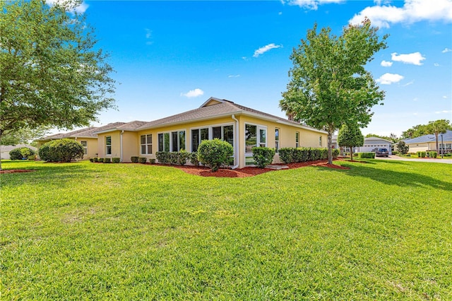 10460 Silver Maple Ave, Oxford, FL 34484 - back of property with a lawn and stucco siding