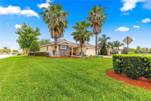 10460 Silver Maple Ave, Oxford, FL 34484 - view of front facade with stucco siding, a front lawn, a garage, and stone siding