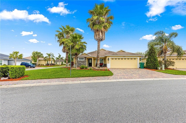 10460 Silver Maple Ave, Oxford, FL 34484 - single story home featuring driveway, an attached garage, a front lawn, and stucco siding