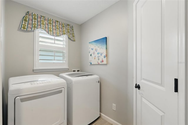 411 S 5th Ave S, Jacksonville Beach, FL 32250 - washroom featuring laundry area, baseboards, and separate washer and dryer