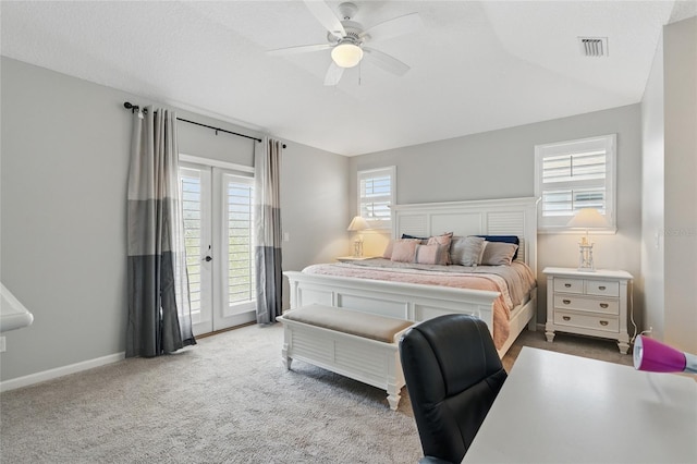 411 S 5th Ave S, Jacksonville Beach, FL 32250 - carpeted bedroom featuring baseboards, visible vents, access to outside, and a ceiling fan