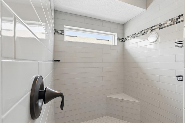 411 S 5th Ave S, Jacksonville Beach, FL 32250 - full bath with tiled shower and a textured ceiling