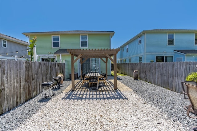 411 S 5th Ave S, Jacksonville Beach, FL 32250 - back of house with a pergola, a fenced backyard, and a patio