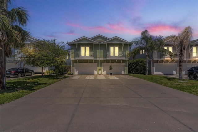 411 S 5th Ave S, Jacksonville Beach, FL 32250 - traditional-style home with a balcony, an attached garage, and concrete driveway
