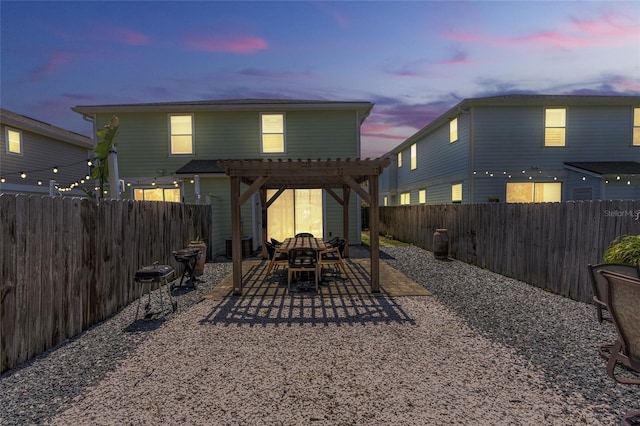411 S 5th Ave S, Jacksonville Beach, FL 32250 - back of house with a patio, a fenced backyard, and a pergola