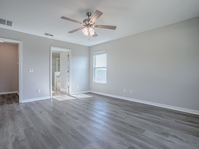 unfurnished bedroom featuring visible vents, baseboards, ceiling fan, and wood finished floors
