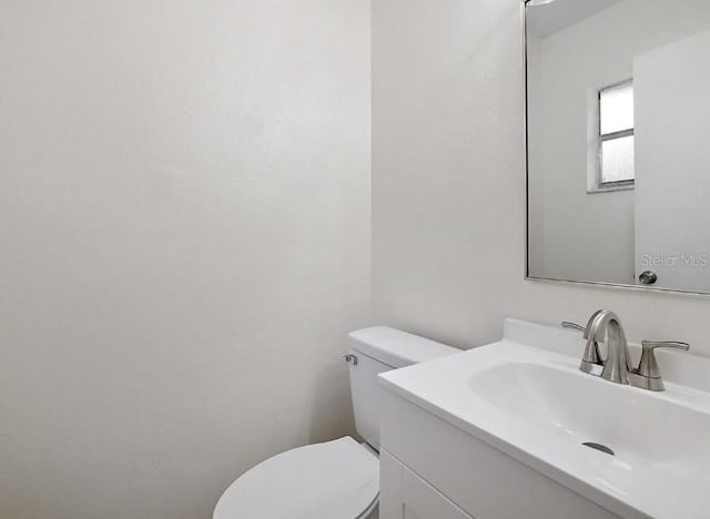 half bath with toilet and vanity