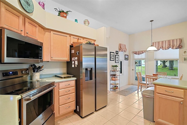 3800 Woodleaf Ct, Leesburg, FL 34748 - kitchen featuring appliances with stainless steel finishes, light countertops, light brown cabinetry, and light tile patterned floors