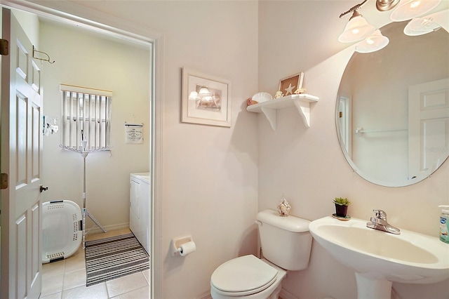 3800 Woodleaf Ct, Leesburg, FL 34748 - bathroom with toilet, tile patterned floors, a sink, and baseboards