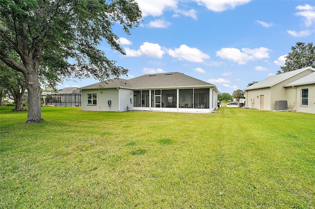 3800 Woodleaf Ct, Leesburg, FL 34748 - back of house with a yard, a sunroom, and stucco siding