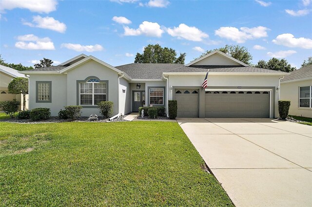 3800 Woodleaf Ct, Leesburg, FL 34748 - single story home featuring a garage, concrete driveway, stucco siding, and a front yard