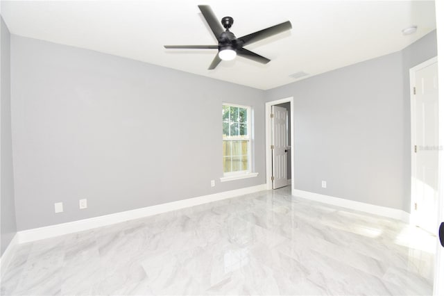 unfurnished bedroom featuring ceiling fan, marble finish floor, baseboards, and visible vents