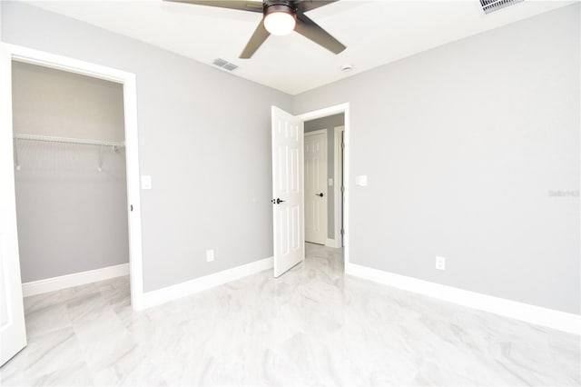 unfurnished bedroom with a closet, visible vents, baseboards, and ceiling fan