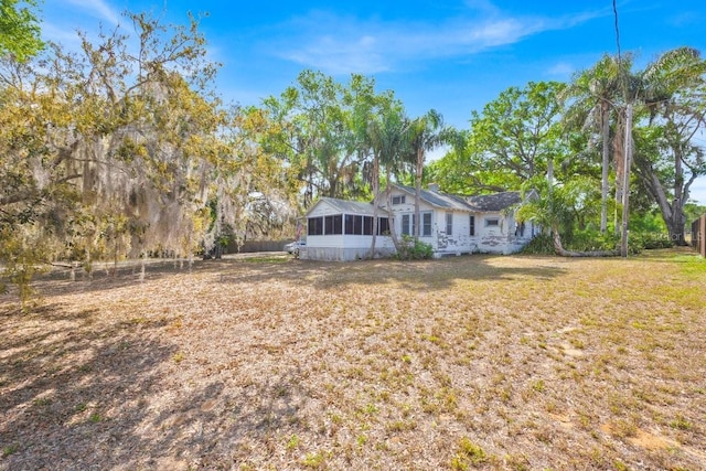 16724 Highland Ave, Montverde, FL 34756 - view of green lawn featuring a sunroom