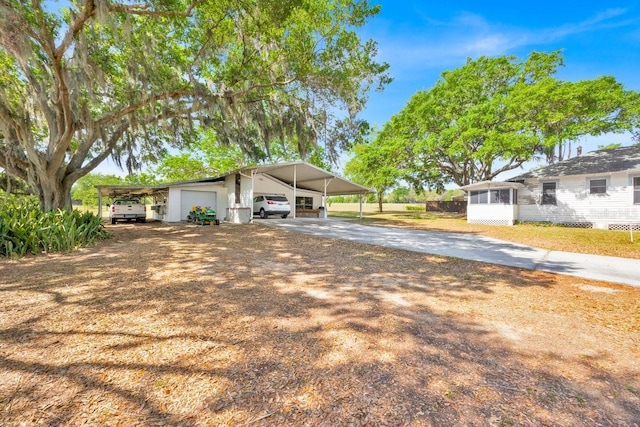 16724 Highland Ave, Montverde, FL 34756 - view of front of property with driveway and a garage