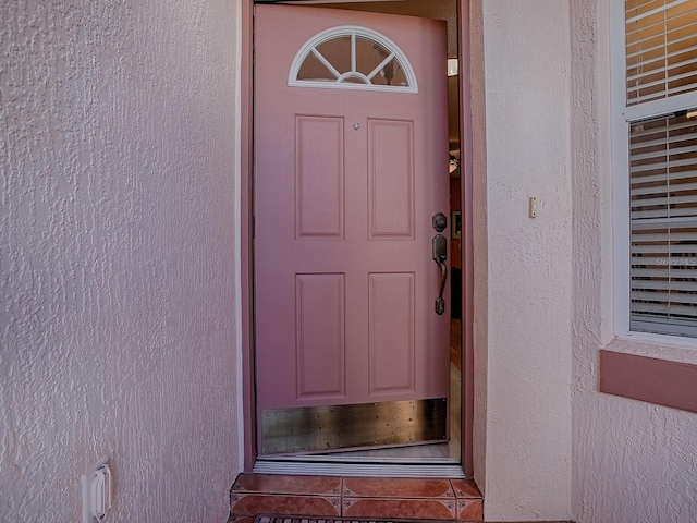 910 Eagles Lndg, Leesburg, FL 34748 - property entrance with stucco siding