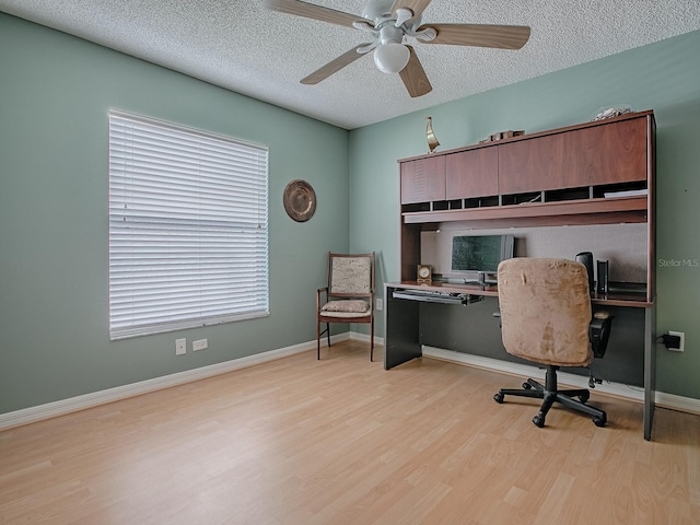 910 Eagles Lndg, Leesburg, FL 34748 - office space with wood finished floors, a ceiling fan, a textured ceiling, and baseboards