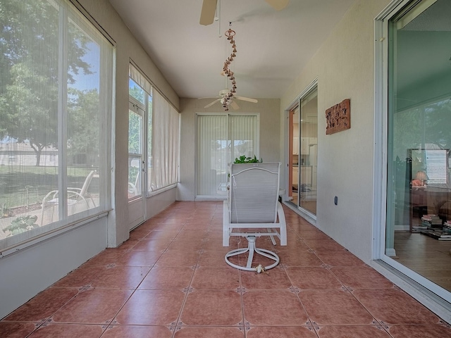 910 Eagles Lndg, Leesburg, FL 34748 - sunroom with a ceiling fan and tile patterned flooring