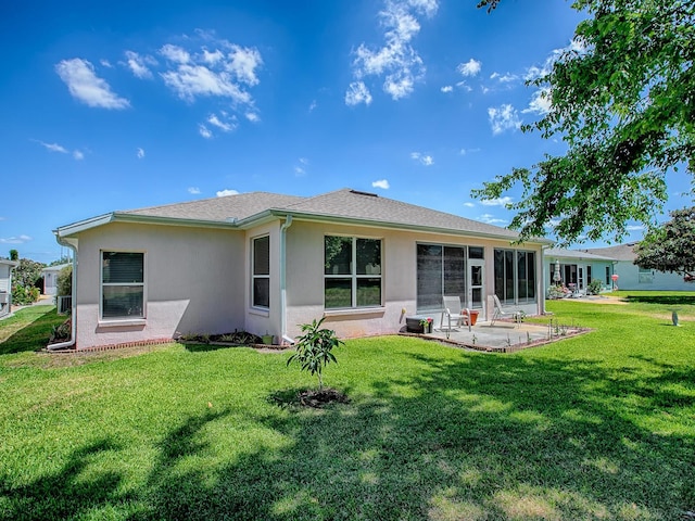 910 Eagles Lndg, Leesburg, FL 34748 - back of property with a patio, stucco siding, and a yard