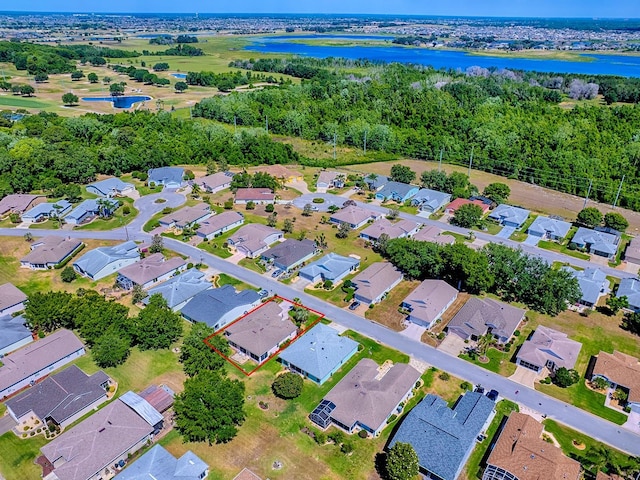 910 Eagles Lndg, Leesburg, FL 34748 - aerial overview of property's location featuring a large body of water, nearby suburban area, and property boundaries highlighted