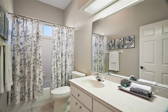full bath featuring tile patterned flooring, vanity, shower / tub combo with curtain, and toilet