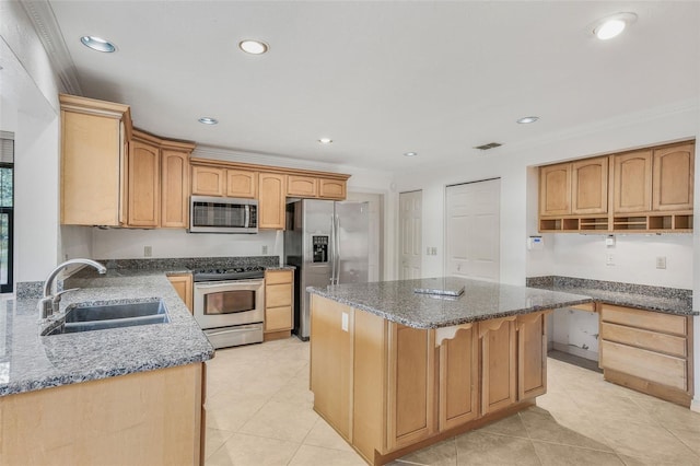 8640 E Henderson Trl, Inverness, FL 34450 - kitchen featuring dark stone counters, a sink, stainless steel appliances, a kitchen island, and recessed lighting