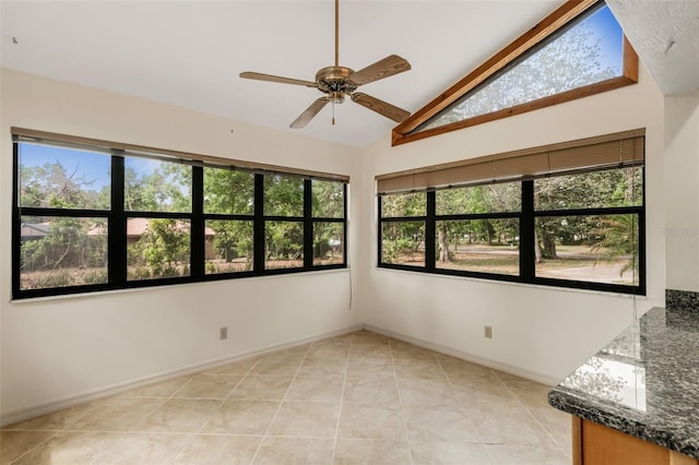 8640 E Henderson Trl, Inverness, FL 34450 - spare room with a ceiling fan, vaulted ceiling, a healthy amount of sunlight, and light tile patterned floors