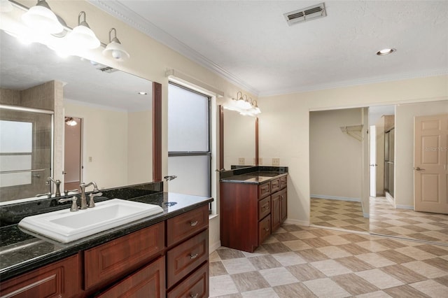 8640 E Henderson Trl, Inverness, FL 34450 - full bath featuring tile patterned floors, a sink, a stall shower, visible vents, and crown molding