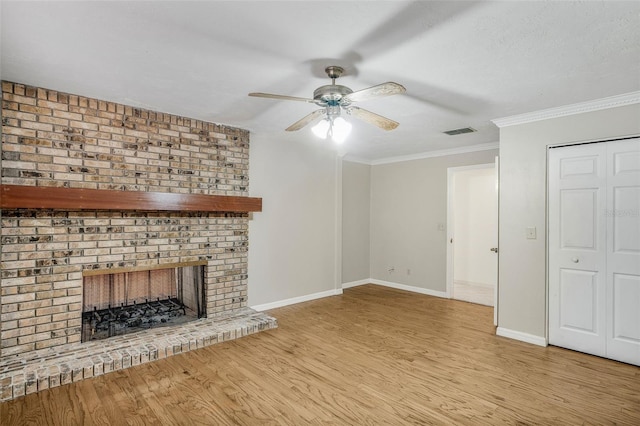 8640 E Henderson Trl, Inverness, FL 34450 - unfurnished living room with wood finished floors, baseboards, a ceiling fan, and visible vents