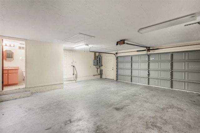 8640 E Henderson Trl, Inverness, FL 34450 - garage with a garage door opener and a sink