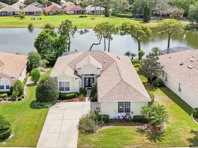 bird's eye view featuring a residential view and a water view