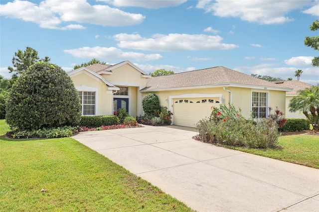 ranch-style home with concrete driveway, a front yard, stucco siding, and an attached garage