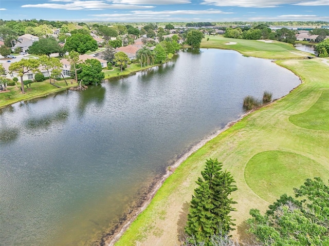 drone / aerial view with a water view, view of golf course, and a residential view