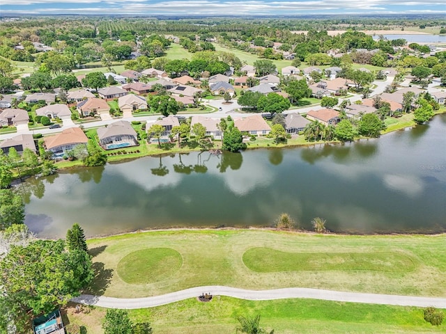 bird's eye view featuring a water view, view of golf course, and a residential view