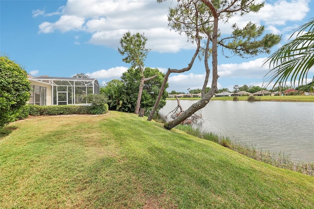 view of yard featuring a water view and a lanai