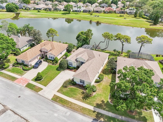 bird's eye view featuring a water view and a residential view