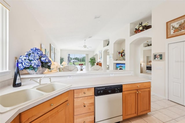 8043 Pine Hollow Dr, Mount Dora, FL 32757 - kitchen with white dishwasher, a sink, light tile patterned floors, light countertops, and ceiling fan