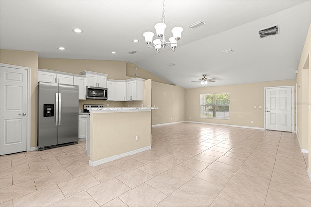 kitchen featuring light countertops, appliances with stainless steel finishes, open floor plan, ceiling fan with notable chandelier, and visible vents