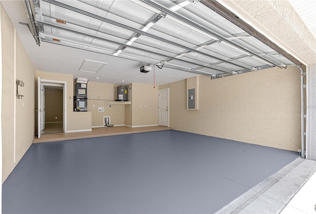 garage featuring concrete block wall, electric panel, electric water heater, and a garage door opener