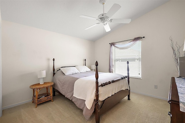 bedroom featuring light carpet, baseboards, a ceiling fan, and vaulted ceiling