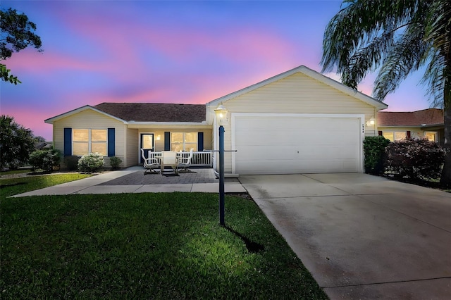 2290 Due W Dr, The Villages, FL 32162 - ranch-style house featuring a front yard, an attached garage, covered porch, and concrete driveway