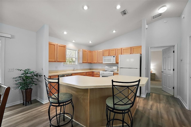 2290 Due W Dr, The Villages, FL 32162 - kitchen featuring dark wood-type flooring, white appliances, and visible vents