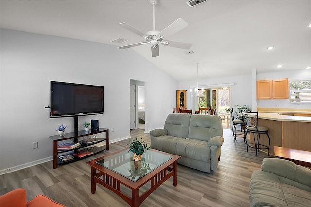 2290 Due W Dr, The Villages, FL 32162 - living room with baseboards, a ceiling fan, recessed lighting, wood finished floors, and vaulted ceiling