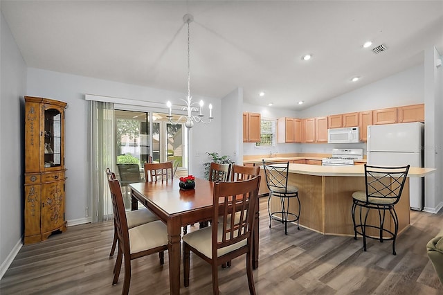 2290 Due W Dr, The Villages, FL 32162 - dining space featuring visible vents, wood finished floors, a healthy amount of sunlight, lofted ceiling, and a notable chandelier