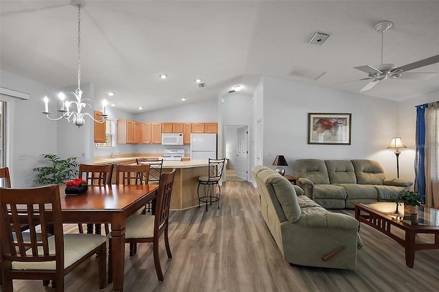 2290 Due W Dr, The Villages, FL 32162 - dining space featuring light wood-type flooring, recessed lighting, visible vents, lofted ceiling, and ceiling fan with notable chandelier