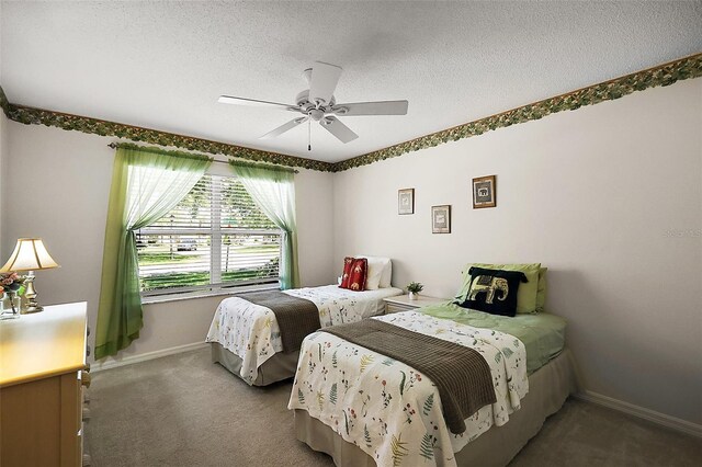 2290 Due W Dr, The Villages, FL 32162 - carpeted bedroom featuring baseboards, a textured ceiling, and ceiling fan
